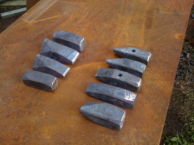 an assortment of forged hammers