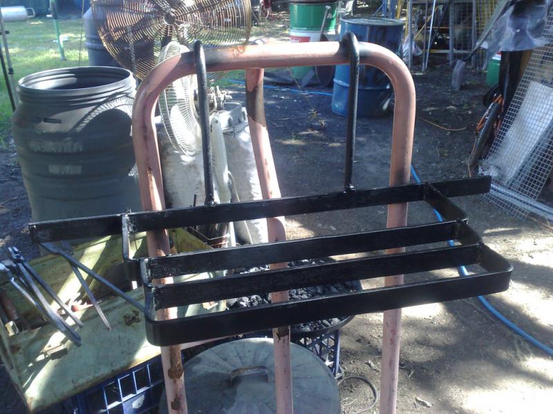 Custom tool racks for tongs and hammers....wheel out...wheel in.